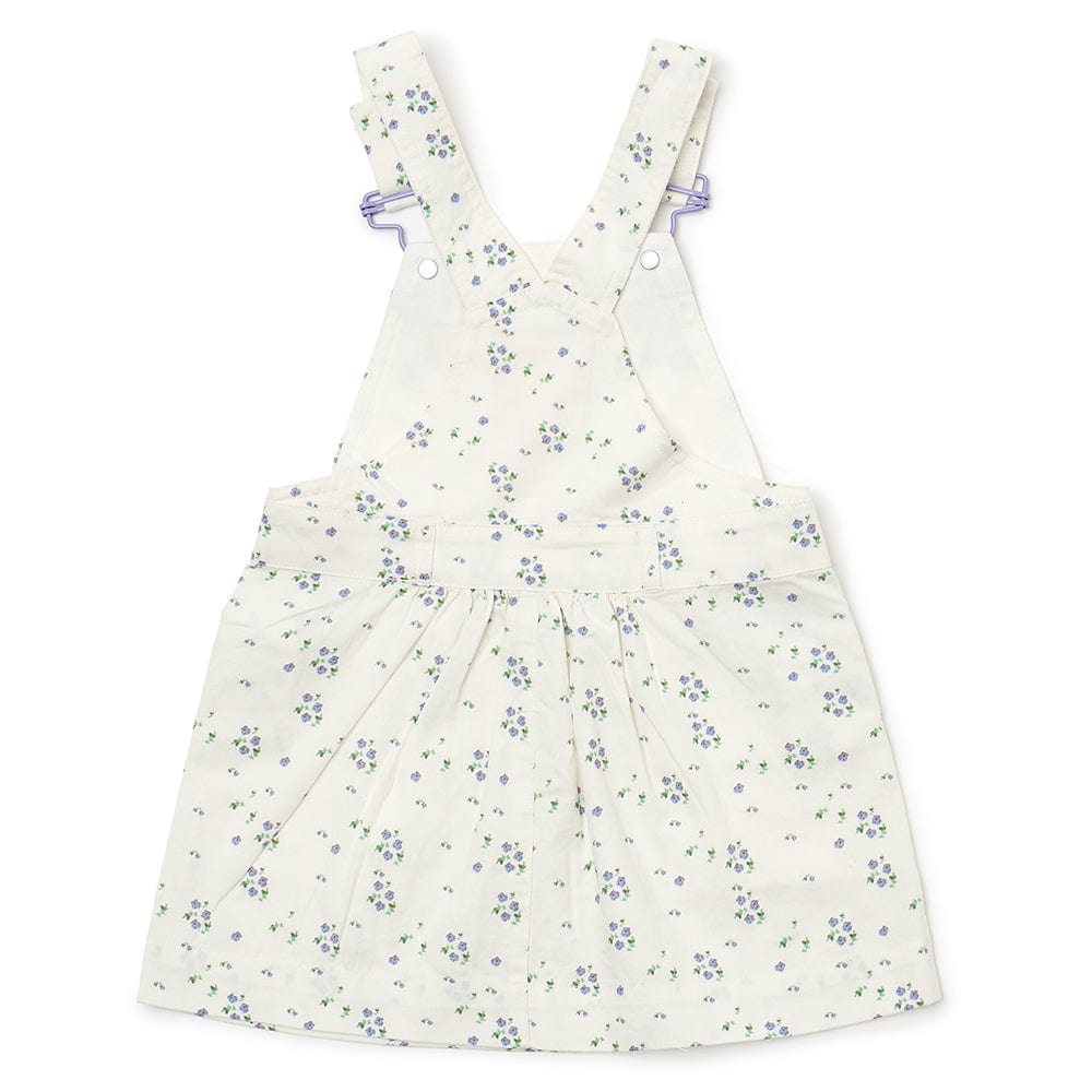 White floral summer dress for girls, featuring white straps and bespoke buttons, paired with matching knickers. 