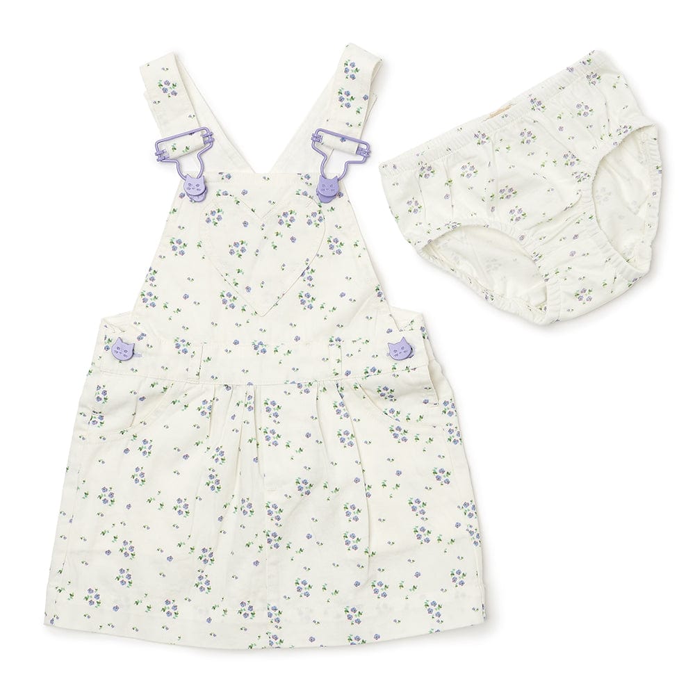 White floral summer dress for girls, featuring white straps and bespoke buttons, paired with matching knickers. 